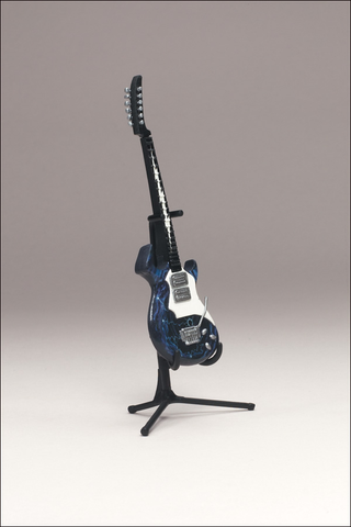 Illustration for article titled McFarlane's Tiny, Plastic Guitar Hero Guitars